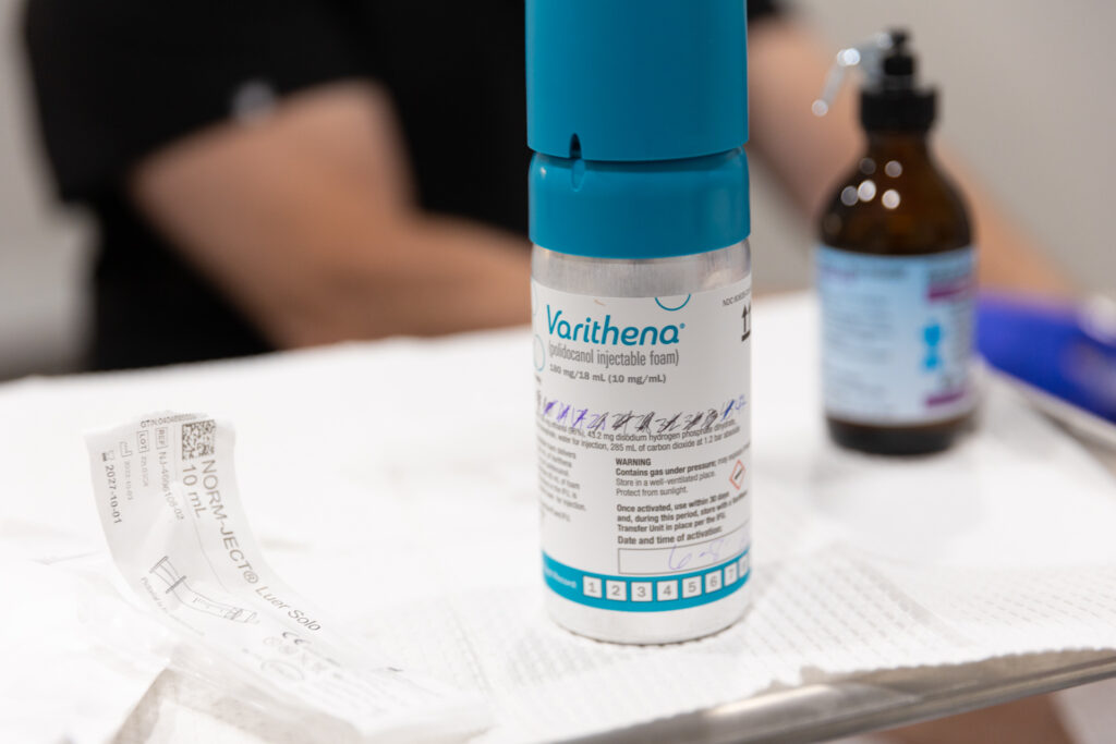 Close-up of an injectable foam canister and medical supplies used for vein care, representing Varithena near Siesta Key.